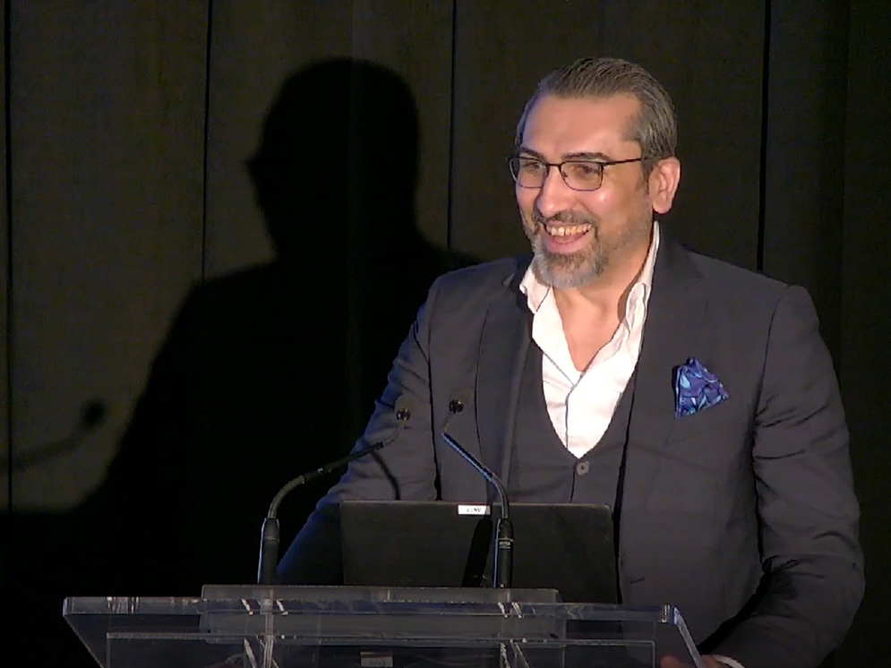 Shot of Mohamad El Chayah President and CEO of SEB Administrative services inc. giving a Speech at an event.