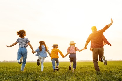 Family of five enjoying their time during sunset