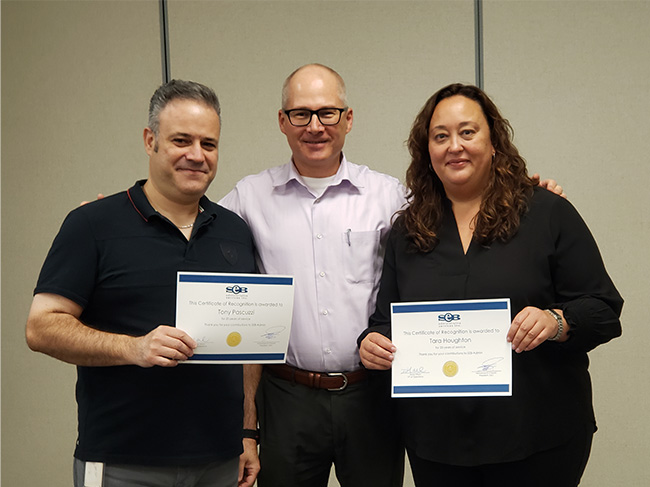 SEB employees posing after getting recognition for their hard work and organization growth