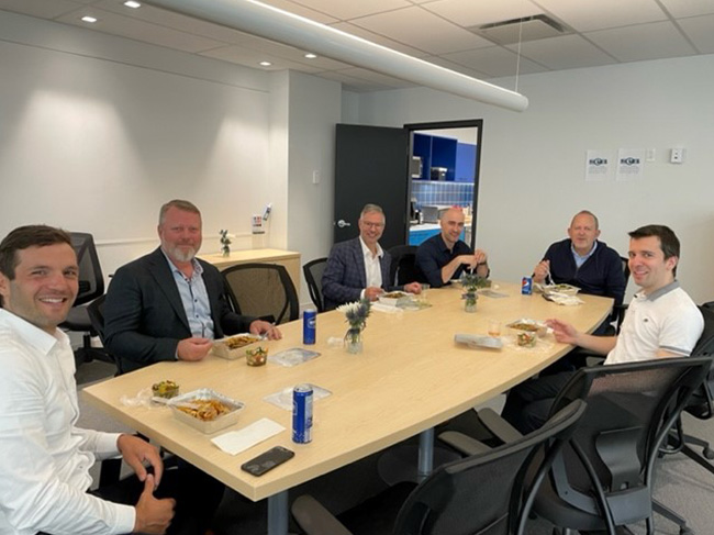 Shot of SEB Group of companies employees in a meeting room posing for the photograph