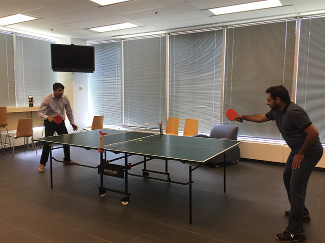 Shot of SEB employees playing table tennis
